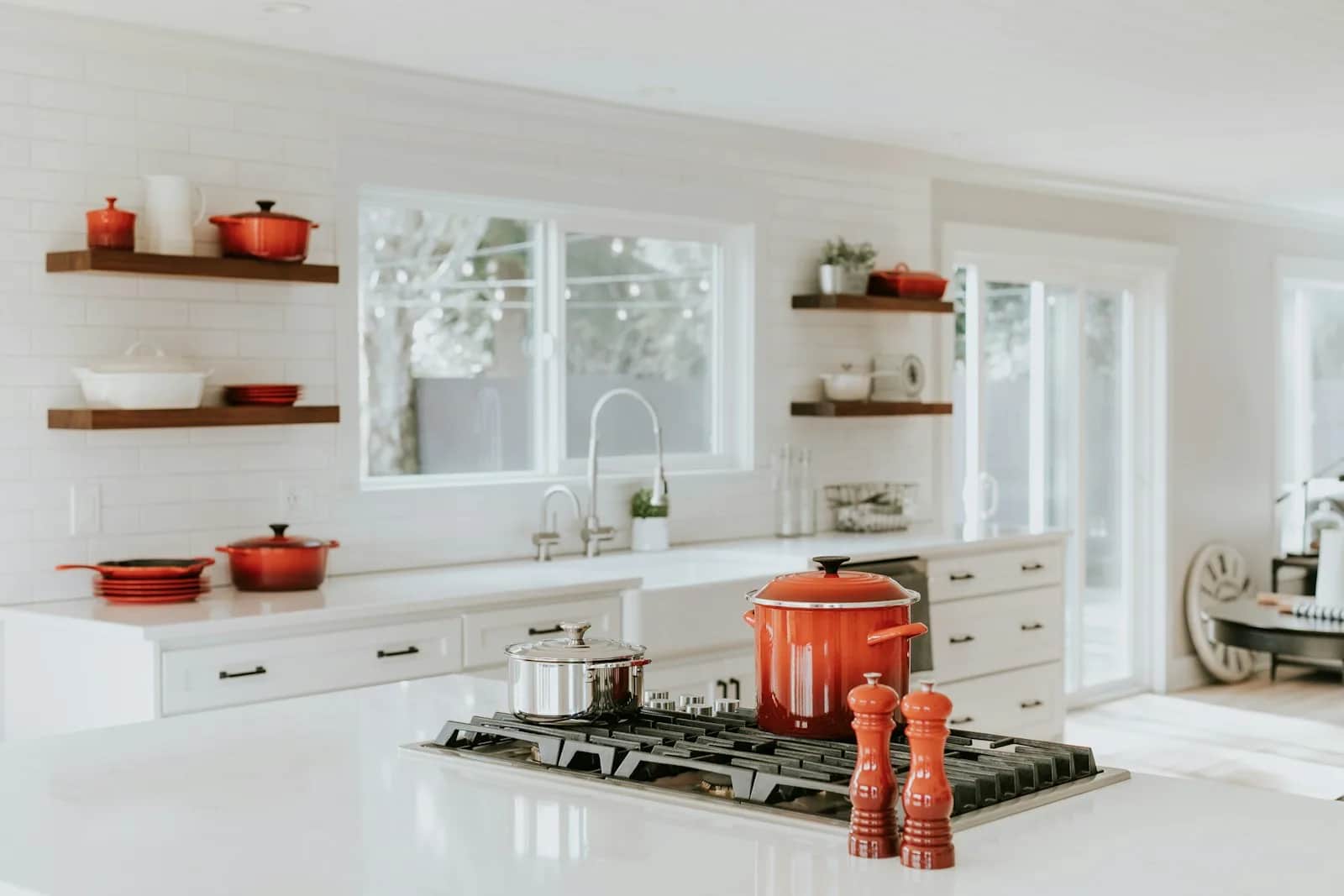 Kitchen with integrated appliances and a warm timber worktop