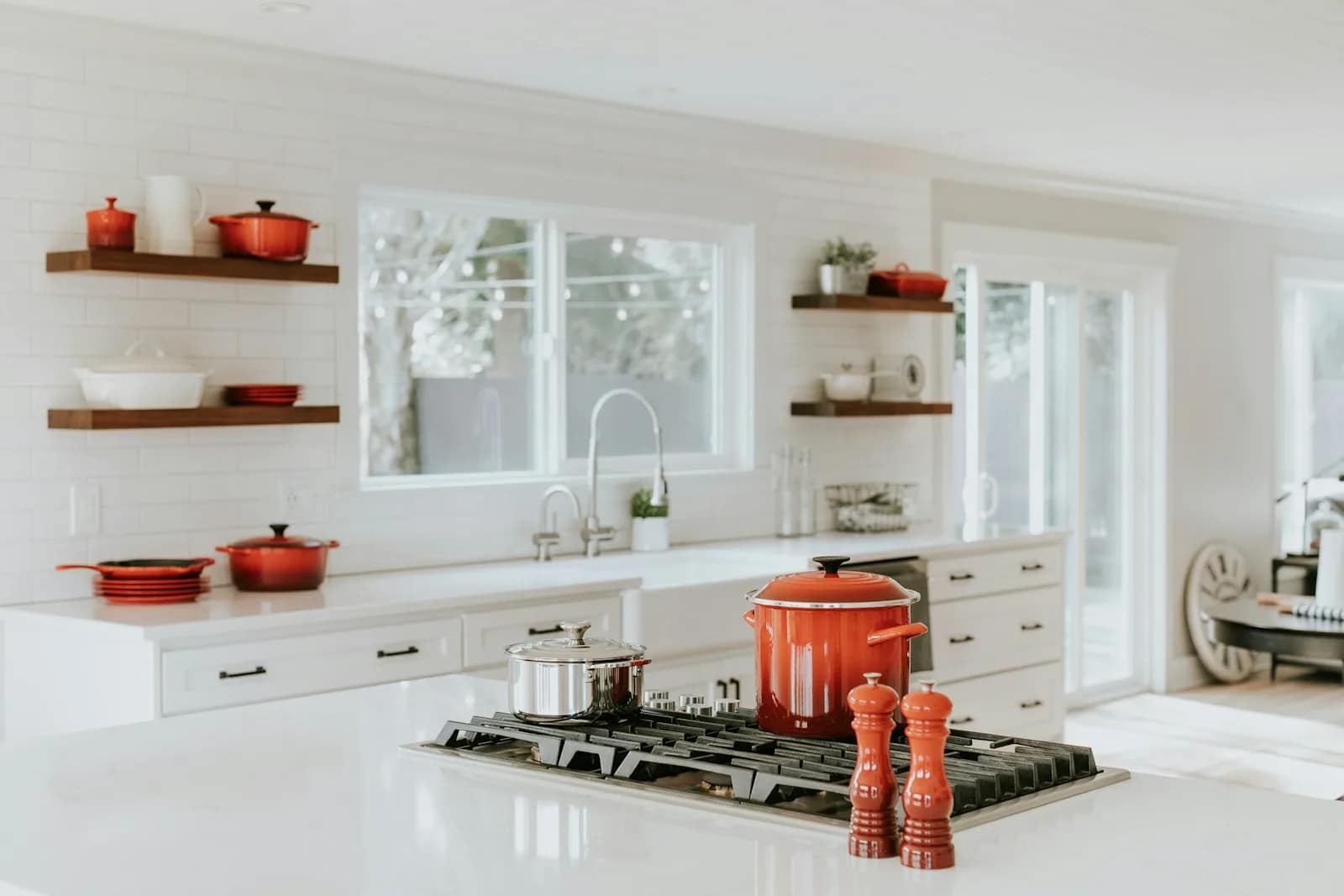 Kitchen with integrated appliances and a warm timber worktop